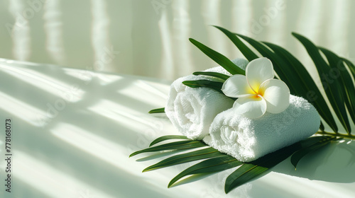 White towels rolled up with green leaf and flower  aesthetic light background. Hotel hospitality concept. Generative AI