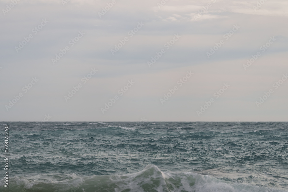 Background of stormy mediterranean sea with horizon