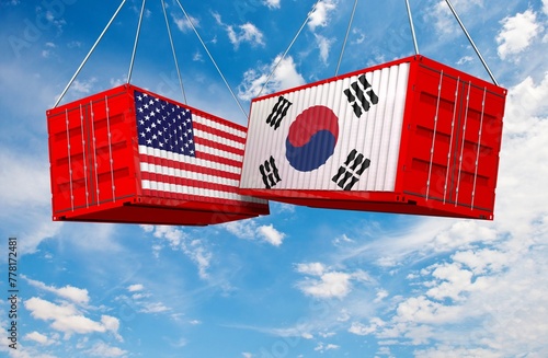 US of America and South Korean flags crashed containers on sky at cloudy background