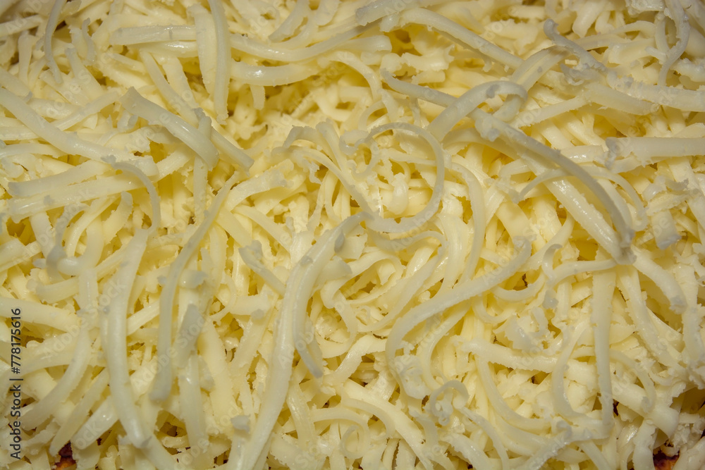 Finely grated hard cheese. The food is hard grated cheese. Grated cheese cooking process Finely grated hard cheese. The food is hard grated cheese. Grated cheese cooking process