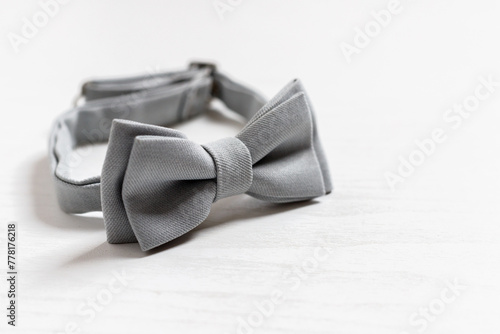 Gray bow tie for a child on a light background, Newborn. Birthday, father's day