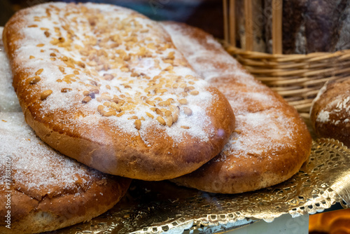 Coca de sant joan. Traditional San Juan cake to celebrate the arrival of summer in Spain made with brioche bread, candied fruit and nuts. photo