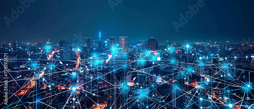 Network connection line between building over the top view of Cityscape at night, world map background which dicut each elements, cool tone color, network and connection concept