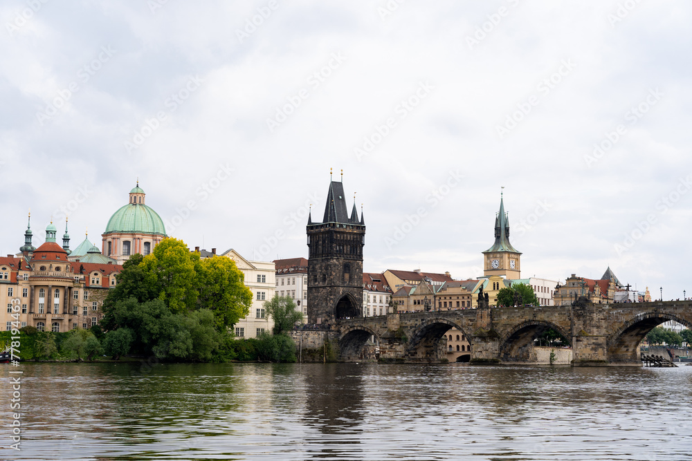 View of Prague cityscape with Charles Bridge, Gothic towers and cathedral.