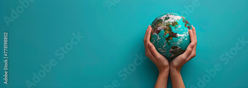 World Environment Day banner with a woman holding the earth globe on a blue background, symbolizing care and responsibility for the planet. photo