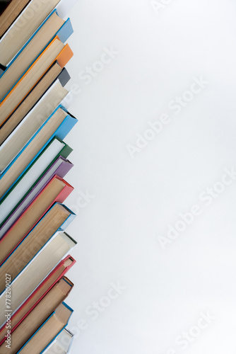 Stack of colorful books. Education background. Back to school. Book, hardback colorful books on wooden table. Education business concept. Copy space for text.