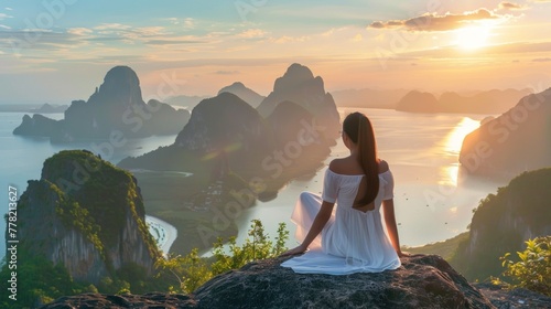 Woman in white dress sitting looking at the panorama and looking at the mountain in the morning .AI generated image