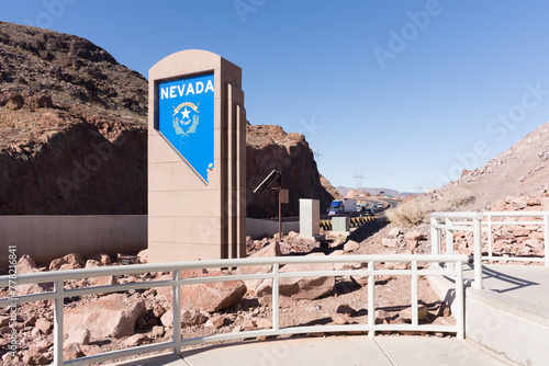 Nevada monument sign on Interstate 11 (U.S. Highway 93), just past the Hoover Dam Bridge, near the Arizona border showing sign and interstate traffic. photo