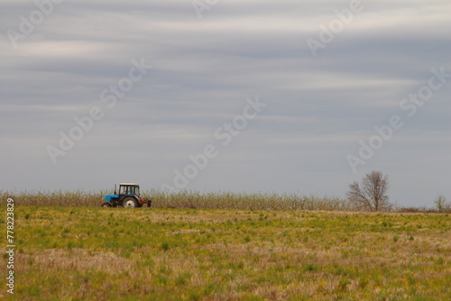 A blue tractor in a field