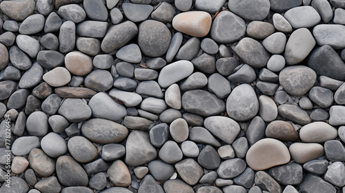 Rocky shore, pebbles, top view. Smooth round and sharp pebbles, texture, background. Close-up