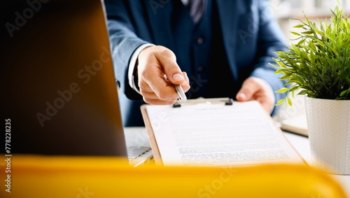 Male arm in suit offer contract form on clipboard pad and silver pen to sign closeup. Strike a bargain for profit white collar motivation union decision corporate sale insurance agent concept