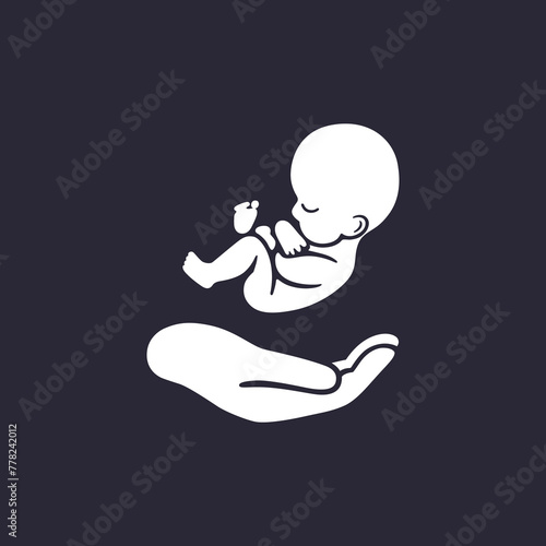 Emblem of infant hovering over mother's arm.