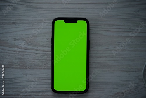 mobile phone with green screen  phone close-up  green screen for background replacement