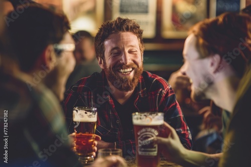 A group of individuals sitting around a table, laughing and enjoying beers together in a casual setting photo