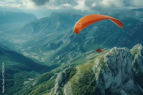 Hang Gliding Adventure Adventurous hang glider soaring above scenic landscapes photo
