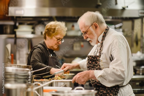 A man and woman  seniors  working together in a kitchen  preparing food  sharing recipes and techniques