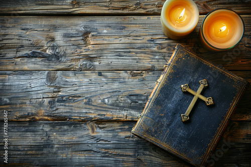 Old Holy Bible, candles and Crucifix on wooden background photo