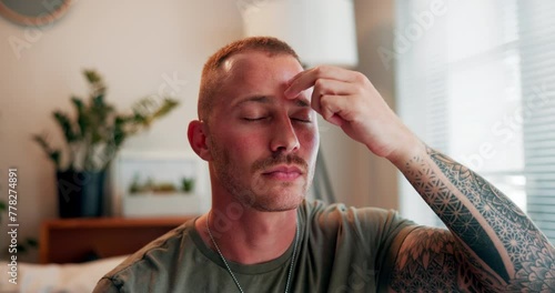 Breathing, therapy and man with eft tapping on sofa for anxiety, mental health and holistic healing. Peace, calm and male person with body energy for reiki treatment for zen in living room at home. photo