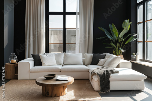 Chic Living Room with Large Windows and Plant Accents. Bright and chic living room featuring a large white sectional sofa, expansive windows with elegant drapery, and vibrant plant accents.