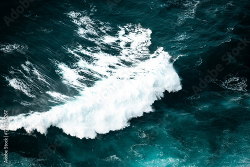 Ocean waves crashing  top down aerial drone view. Storm on sea or ocean