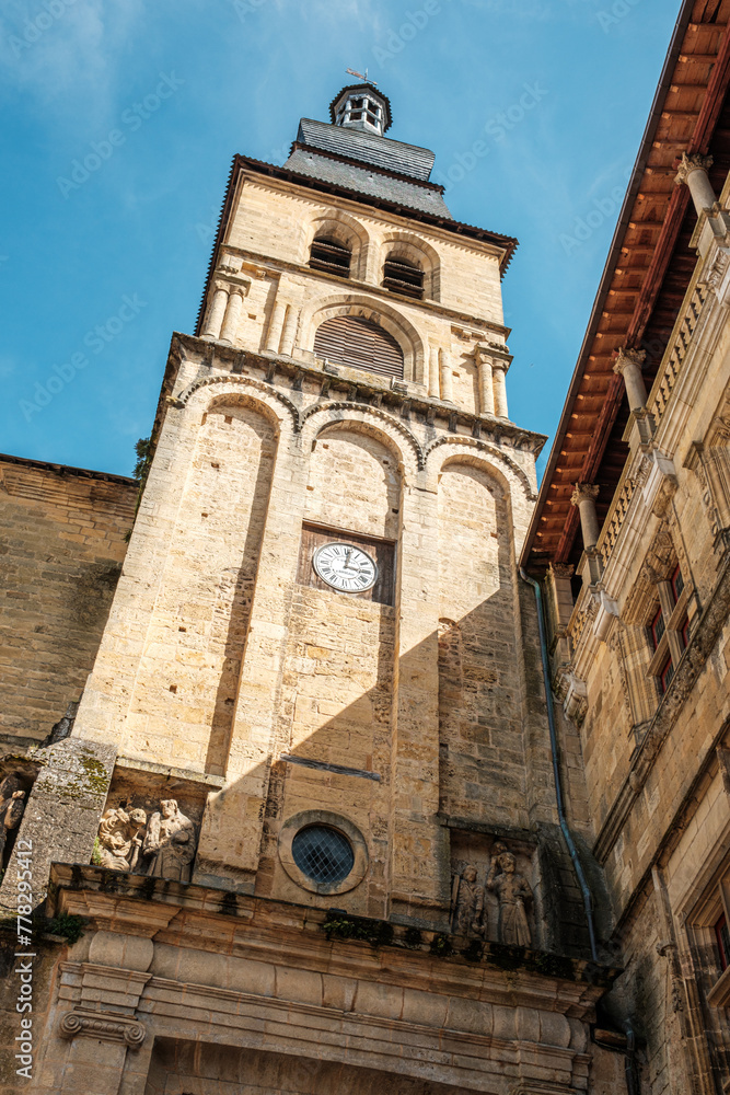View looking up the clock tower of the Cathedrale Saint-Sacerdos in Sarlat-la-Caneda in the Dordogne region of France