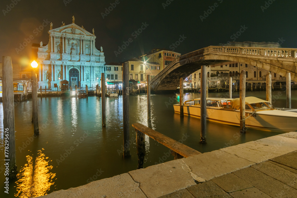 Nightscape of Grand Canal and illuminated ancient Santa Maria di Nazareth Church on a winter evening, Venice, Veneto, Italy