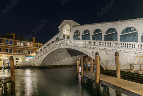 Nightscape of illuminated Rialto Bridge over the Canal Grande in winter time, Venice, Veneto, Italy