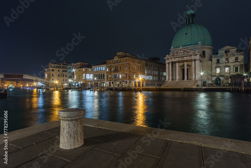 Illuminated church of San Simeone Piccolo at Grand Canal on a winter night, Venice, Veneto, Italy photo