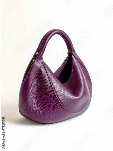 Purple leather hobo bag on white background. photo