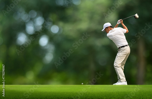 Front view of Golfer driver back swing before hitting golf ball down the fairway.