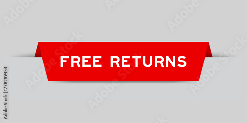 Red color inserted label with word free returns on gray background
