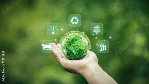 Green Technology. Globe on palm with icons and green background. green technology concept Using technology that preserves the environment and investing in green businesses
