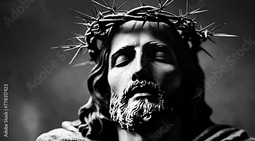 Jesus Christ statute wearing crown of thorns. In black and white. Can be used as background. Concept of church and Cristianity. Savior of humanity portrait. photo