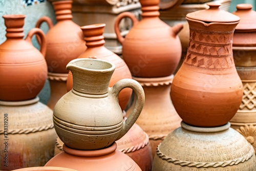 Traditional pottery on Nizwa Souq, Oman © monticellllo
