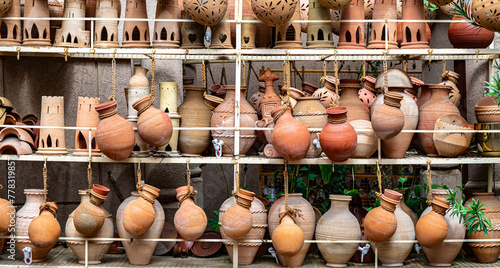 Traditional pottery on Nizwa Souq, Oman © monticellllo