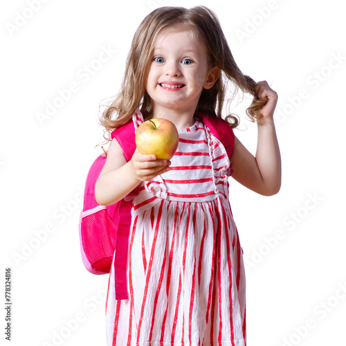 Girl child with backpack in hands apple looking smiling on white background isolation. Childhood, education, products children