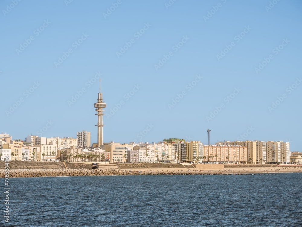 A view of the Cadiz waterfront in Spain and the view along Playa Santa Maria del Mar.