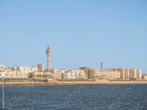 A view of the Cadiz waterfront in Spain and the view along Playa Santa Maria del Mar. © MatyasSipos