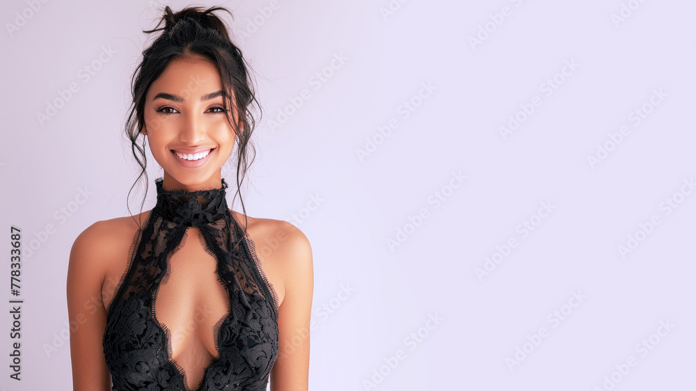 Indian elegant woman in black halter neck dress isolated on grey Indian elegant woman in black halter neck dress isolated on grey