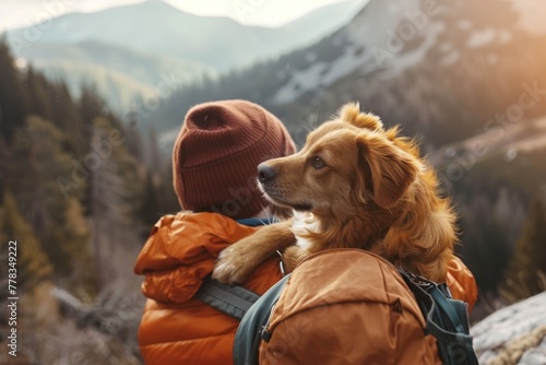 A content dog peeks over the shoulder of its owner against a mountainous backdrop, perfect for showcasing the bond during pet-friendly adventures. photo