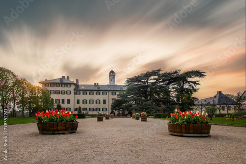 A castle with a park in the sunset. Historical building. Summer residence of the Prussian kings and German emperors in Bad Homburg, Hesse Germany photo