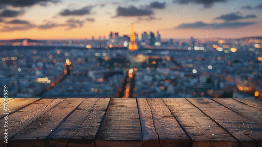 Blurred city view with wooden plank foreground - This image portrays a soft focus city vista at dusk with dewy wooden planks in the foreground, providing depth and context - obrazy, fototapety, plakaty 