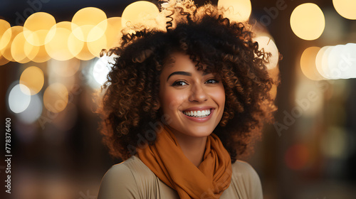 Portrait of beautiful young woman with afro hairstyle at night
