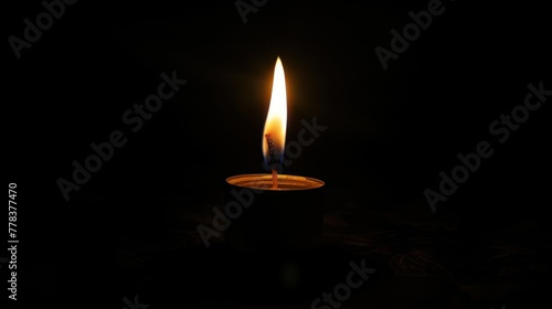 A single candle illuminating the darkness symbolizing hope and perseverance
