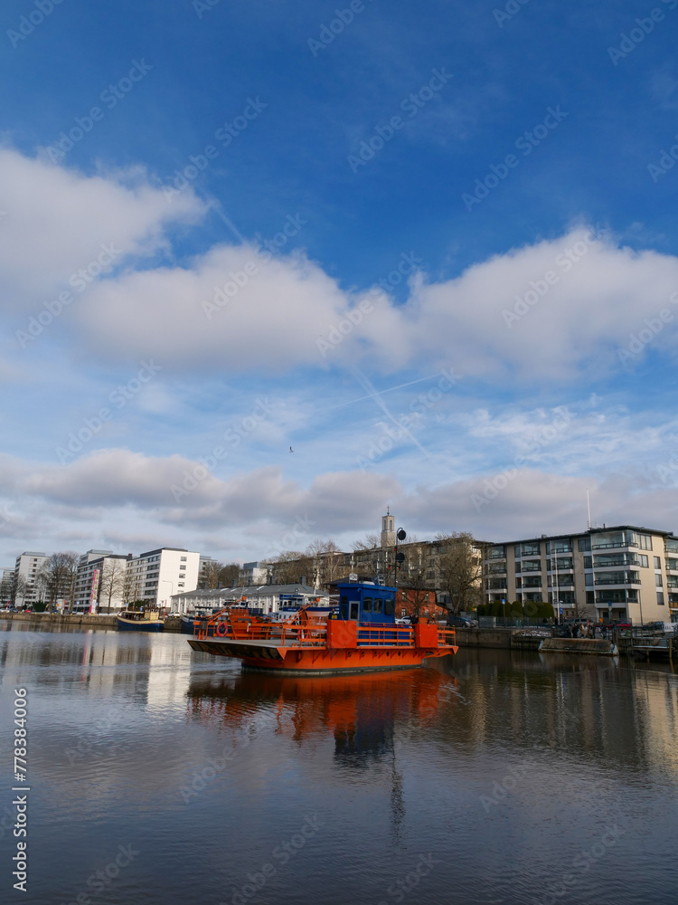 A beautiful view on the shore of Aura river on a sunny spring day. Turku, Finland