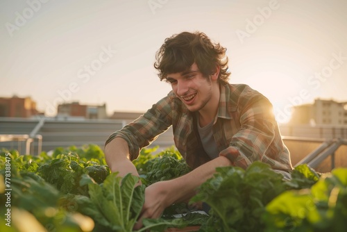 Joyful Urban Male Farmer Tending to Rooftop Garden at Sunset photo