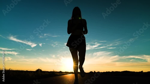 silhouette sports girl running legs along road sunset, joggers park, triathlon competition, sport leisure fitness, healthy running concept, fitness sports woman running up, you can run fast, cardio photo