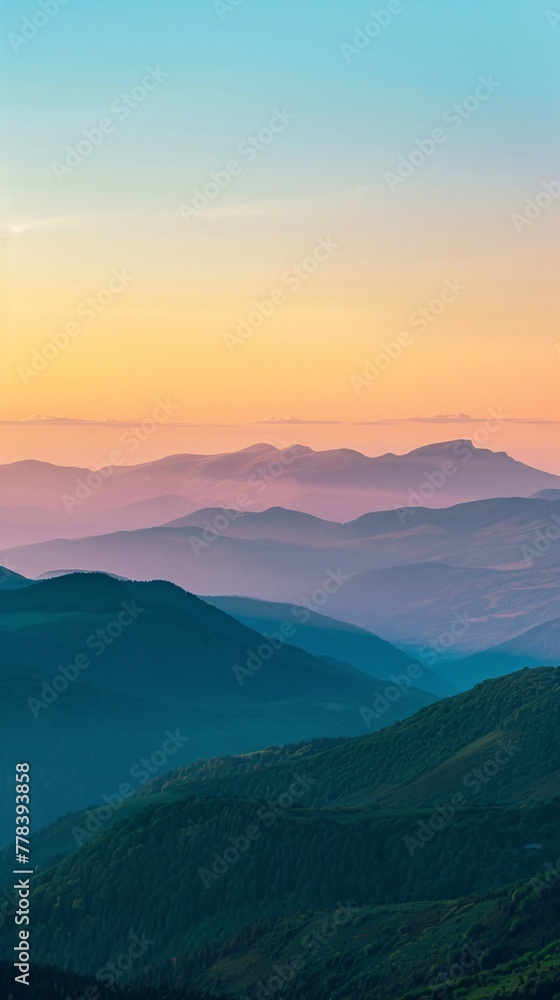 Sunset over majestic mountain peaks.