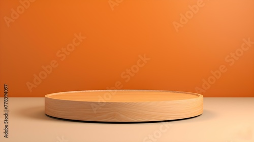 Close up of a round wooden Pedestal for Product Presentation. Empty light orange Showroom
