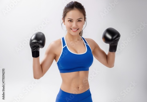 Young and Beautiful Asian Girl in Blue Bra and Boxing Gloves
